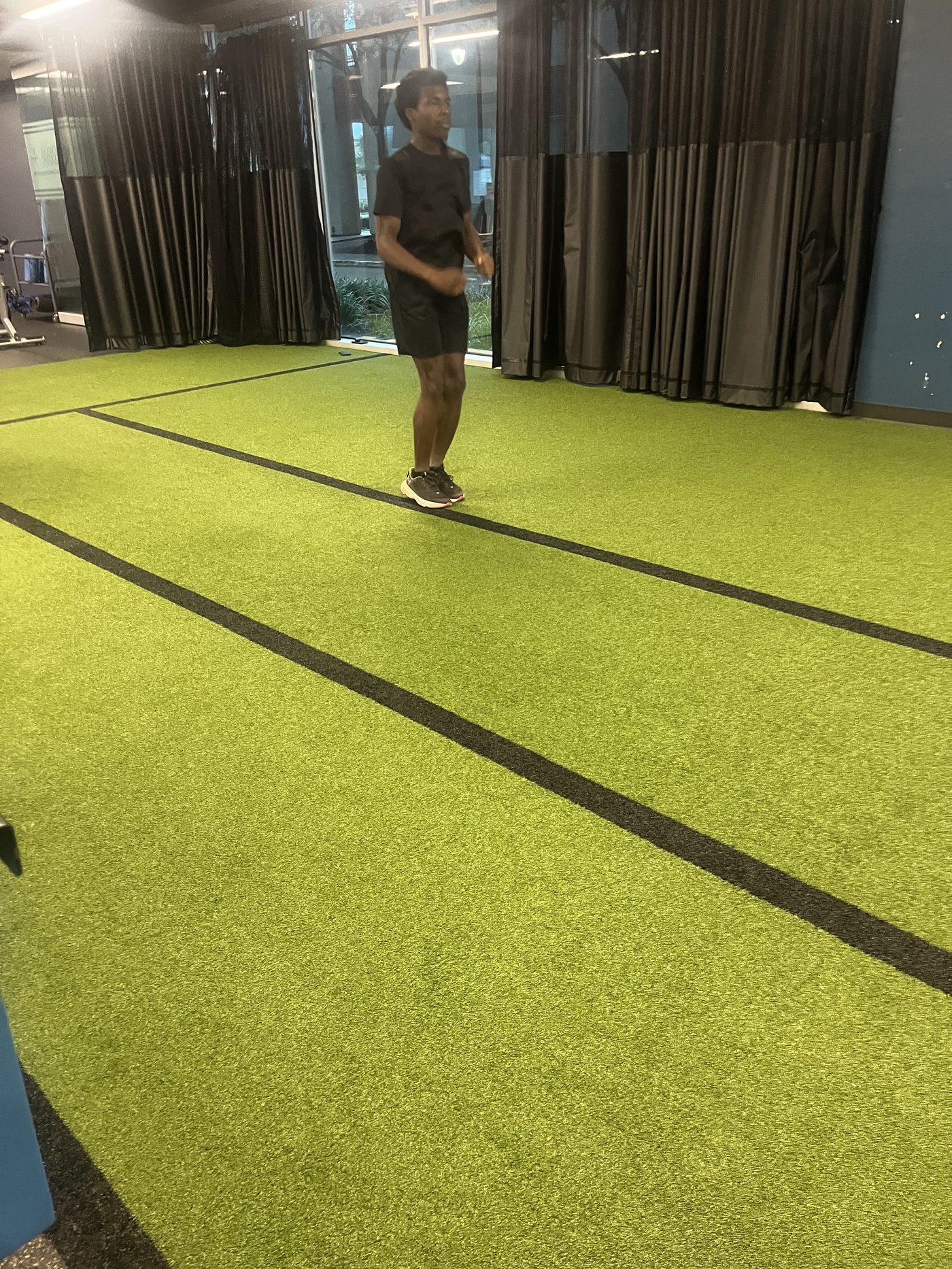 Christian C. Ferguson training indoors on turf